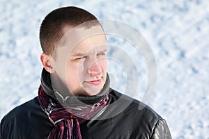 Young man stands and looks far