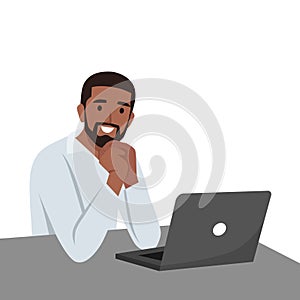 Young man staring at a laptop. Man looking at computer. Thinking man. Man watching monitor screen