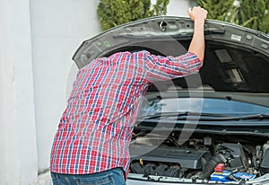 The young man stressed that there was a problem with his broken car and he was thinking of how to fix his car