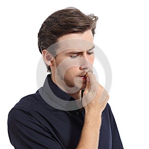 Young man stressed or worried biting nails