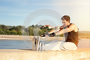 Young man stretching his legs