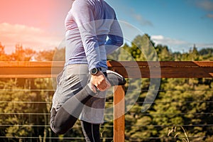 A young man stretching before a run