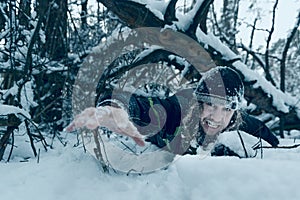 Young man struggles for his life in a deep snow photo