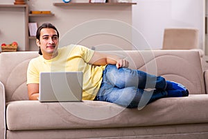 Young man student freelancer in teleworking concept