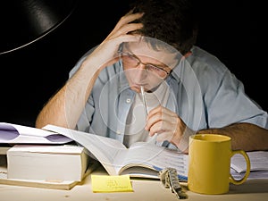 Young Man Studying at Night