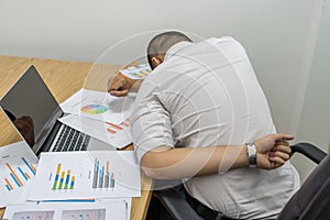 Young man suffering from backache in office