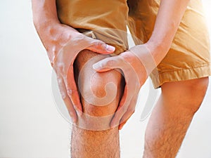 Young man suffering osteoarthritis knee pain