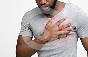 Young man suffering from severe chest pain