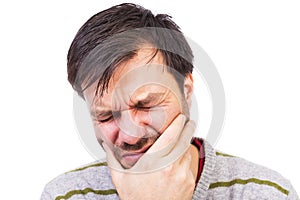 Young man suffering from a terrible tooth ache