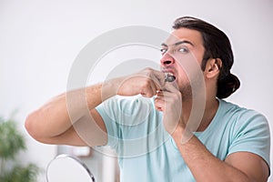 Young man suffering from toothache