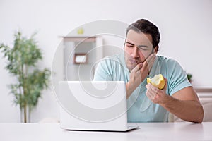 Young man suffering from toothache