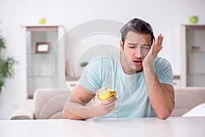 Young man suffering from toothache