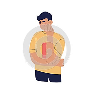 Young man suffering from toothache. Guy with painful expression, holding his cheek with hand