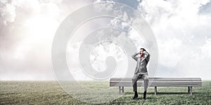 Young man in suit in park dont want to hear anything