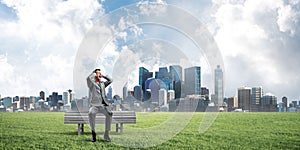 Young man in suit in park dont want to hear anything