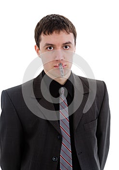 Young man in a suit, a pin with your mouth closed.