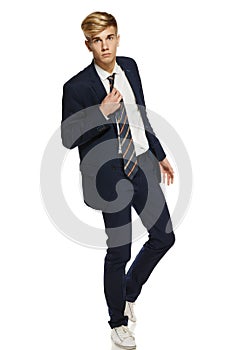 Young man in suit walking