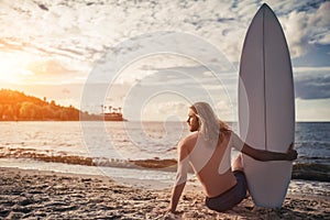 Young man with surfboard