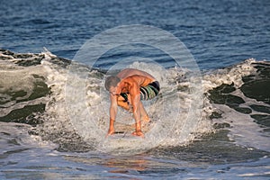 Young Man Surfer Surfing Wave