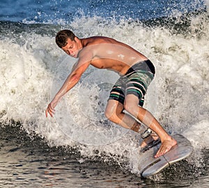 Young Man Surfer Surfing Wave