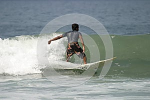Young Man Surfing
