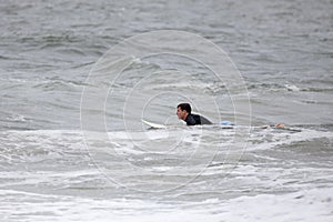 Young Man Surfing