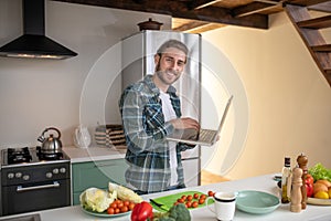 Young man surfing internet for salad recipy