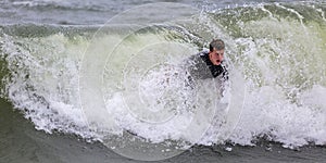 Young Man Surfing