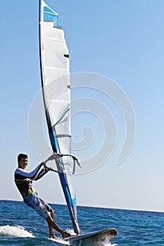 Young man surfing the wind