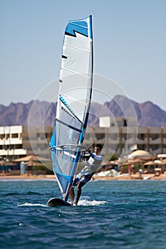 Young man surfing the wind