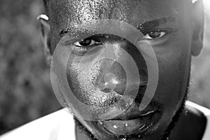 Young man sweating with intense look of face