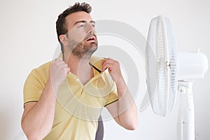 Young man sweating because summer heat haze