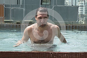 Young man at swimming pool