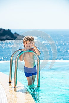 Young man. Swimming Pool Concept. Summer vacation and travel to ocean.