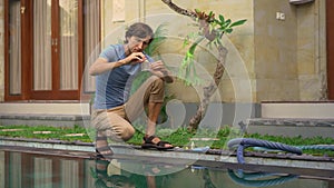 Young man swimming pool serviceman checking chlorine, PH and other chemical levels