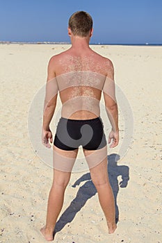 Young man in swimming trunks