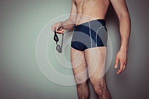 Young man in swimming trunks