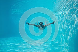Young man swimming underwater