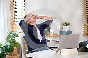 Young man take a break while working with computer at home, Overworked freelancer relax from laptop