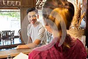 Young man talk with waiters