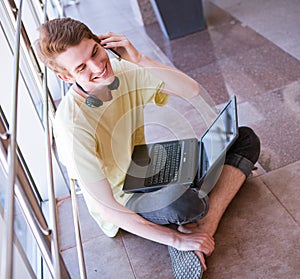 Young man talking by phone