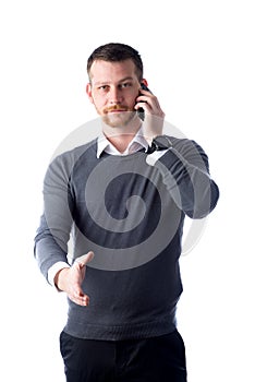 Young man talking on phone and reaching out hand