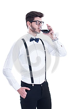 Young man tasting red wine. Isolated on white background