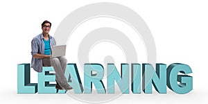 The young man in telelearning concept with laptop and books