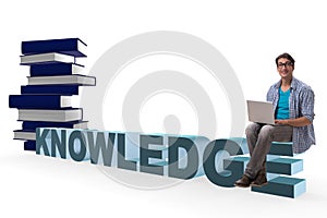 The young man in telelearning concept with laptop and books