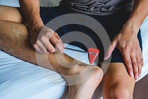 Young man testing wrist joint reflex