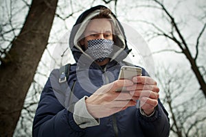 Young man with the textil mask photo