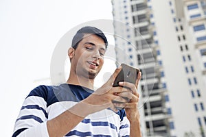 Young man texting on the phone