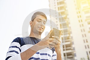 Young man texting on the phone