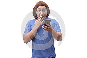 Young Man Texting Reading Chatting on His Phone Surprised Gesture